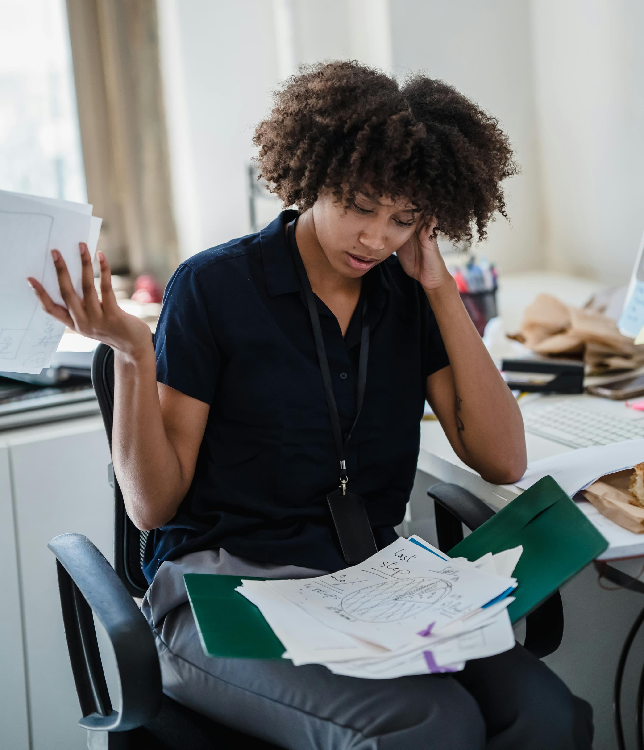 A parent feeling overwhelmed by paperwork
