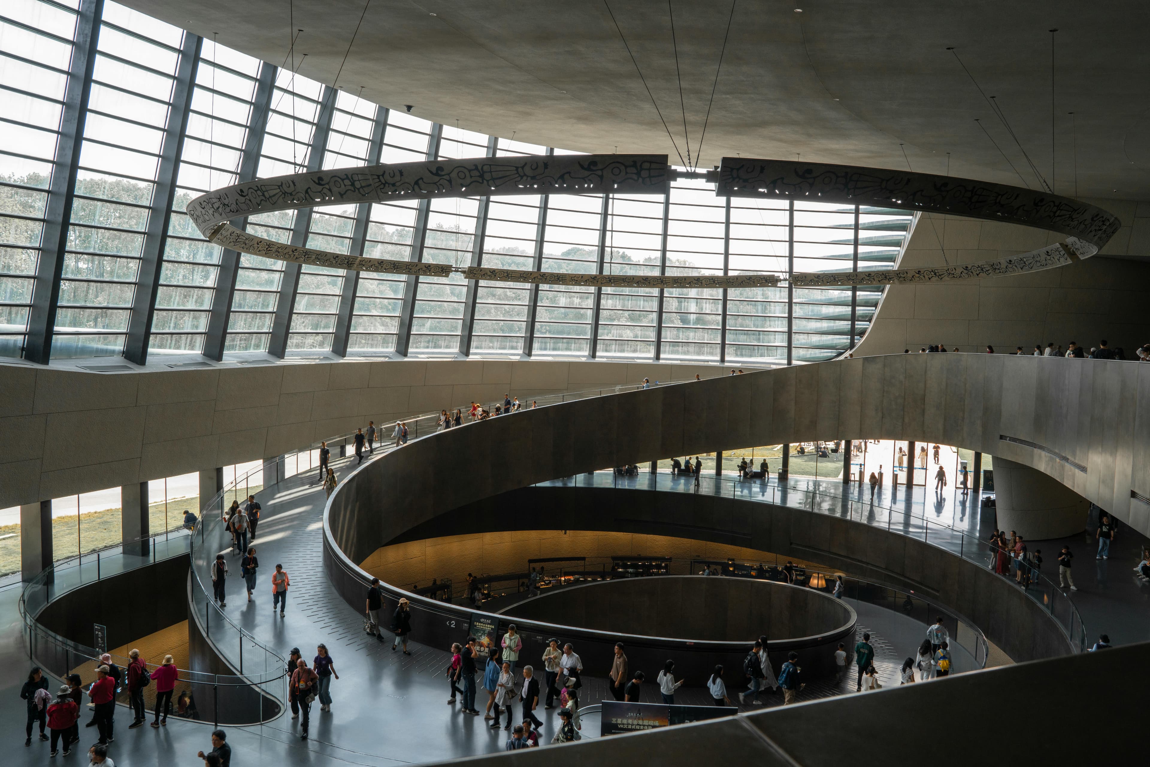 Museum interior with people walking through the space